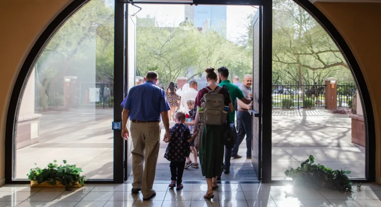 People walking out of DPC lobby